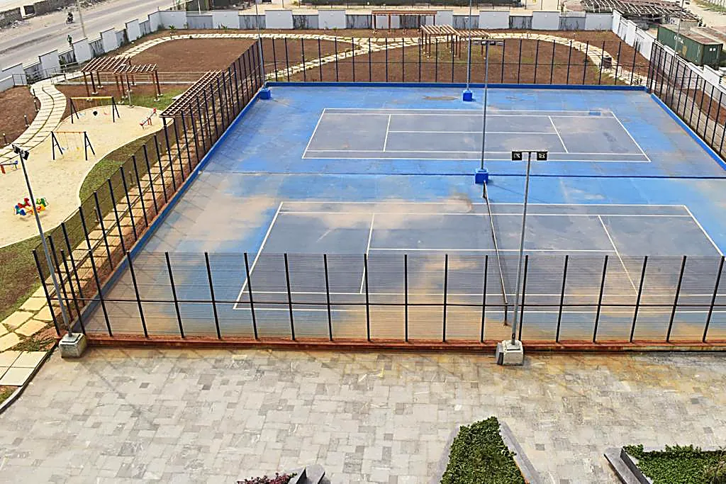 Floodlit lawn tennis and basketball courts